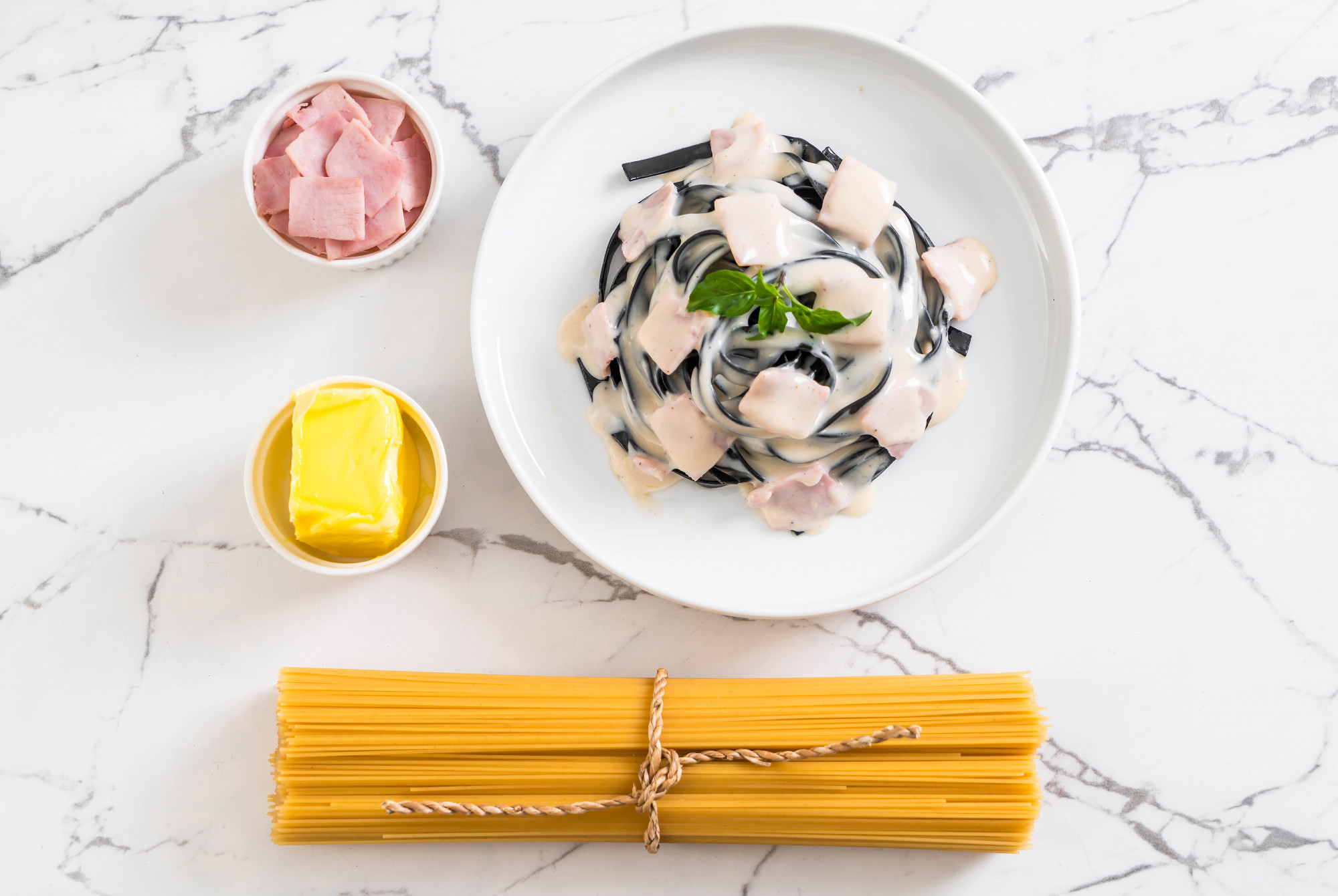 Large editorial shot of a finished pasta bowl on paper